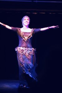 Lurainya Koerber, bellydancer, in coin costume assuit beledi dress showing appreciation to her audience at the Bucks Fever Talent Show
